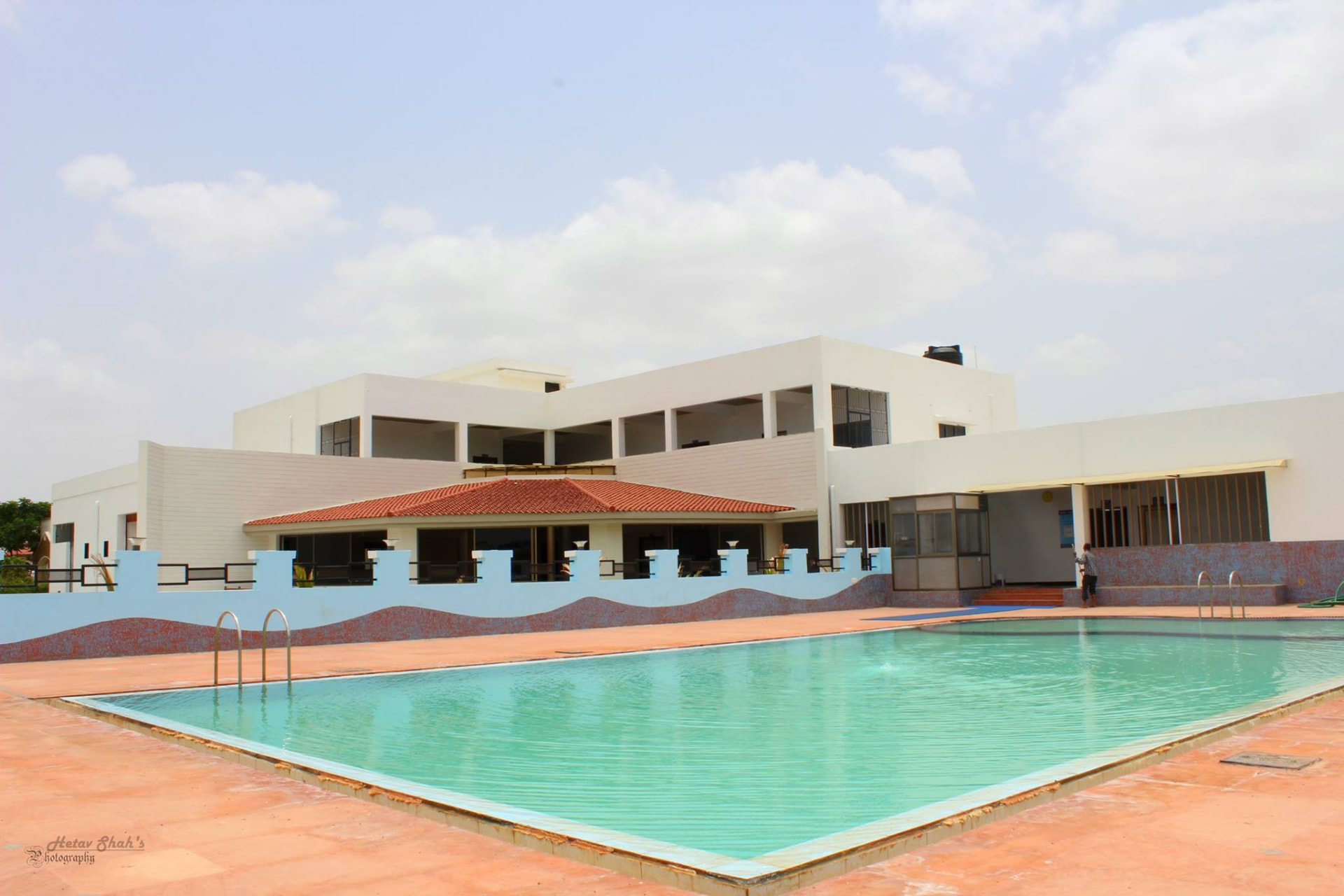 Swimming pool and clubhouse at Mahudi Township